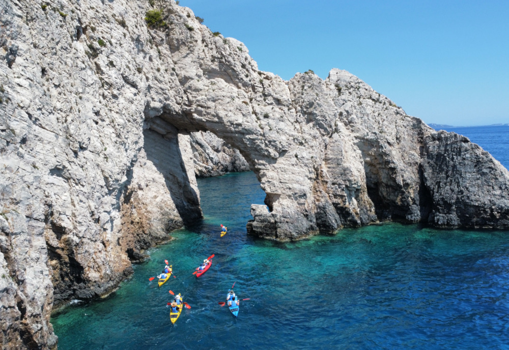Kayaks under the Arch of Keri Caves