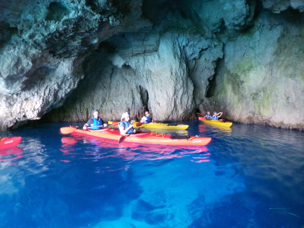  Group of kayaks inside blue caves Zakynthos