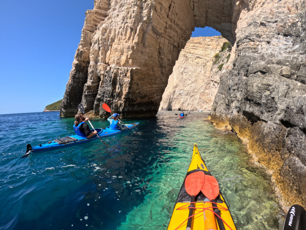  Sea kayaks under high cliffs Keri Caves Zakynthos