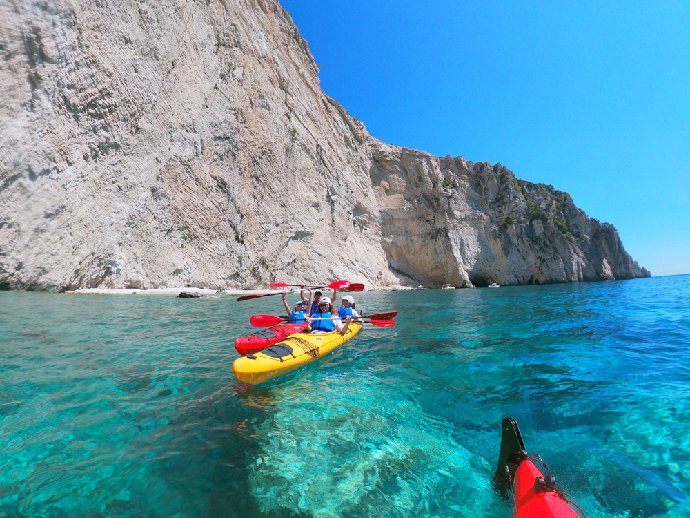 Sea kayaks under cliffs in Keri Caves Zakynthos